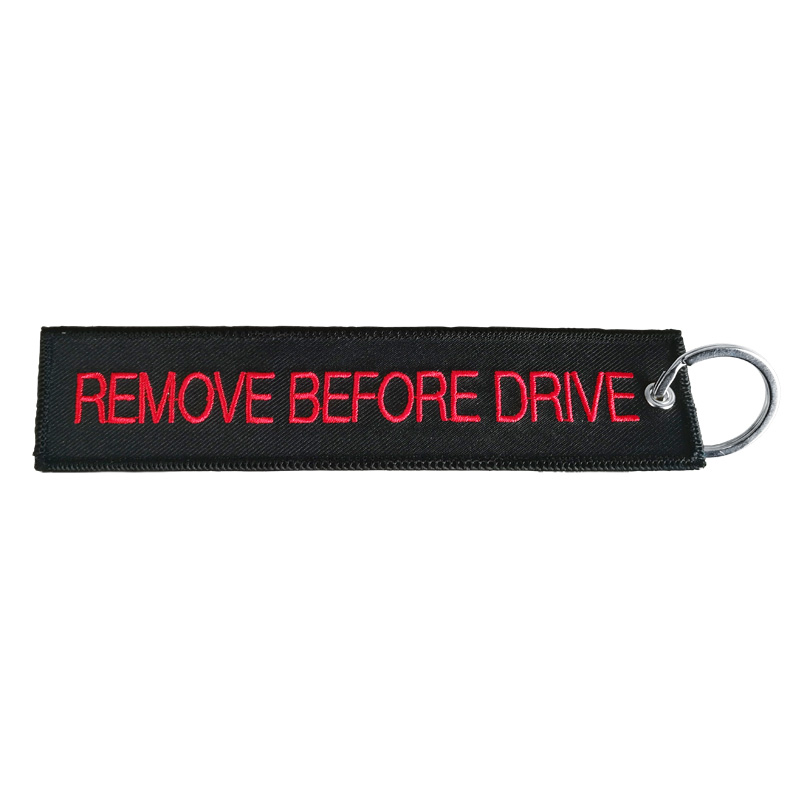 Simoni Racing Sleutelhanger Remove Before Drive - Zwart